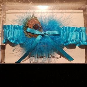 NIB Blue garter with peacock feather